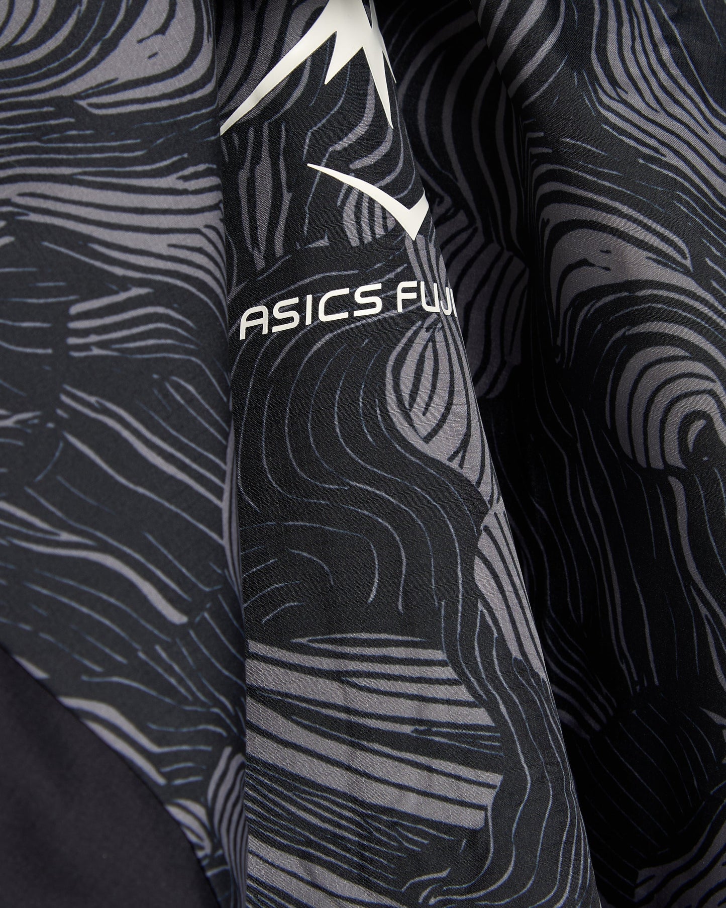 Chaqueta impermeable Relaxed ASICS Fujitrail Packable para hombre
