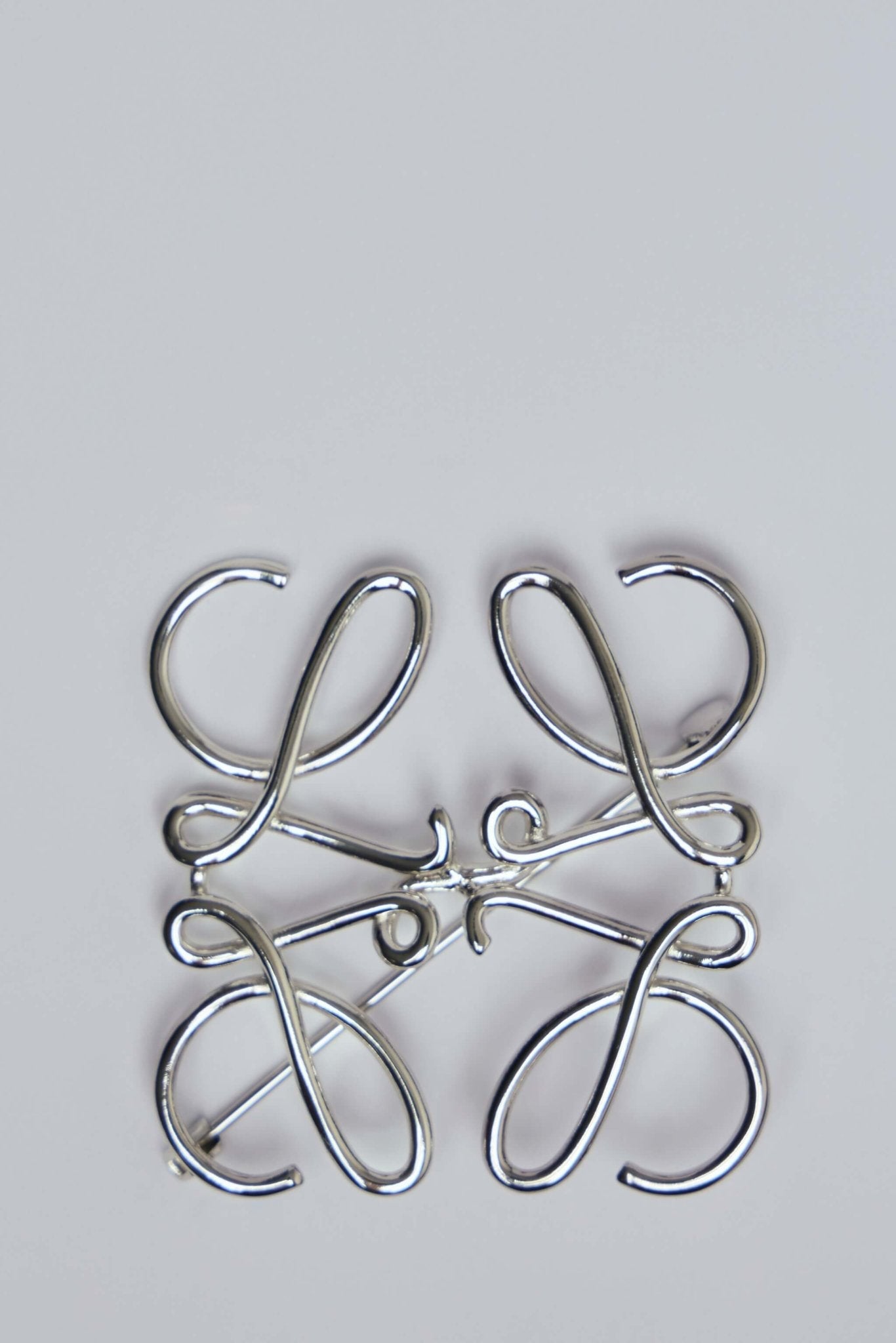 Anagram Brooch in Metal