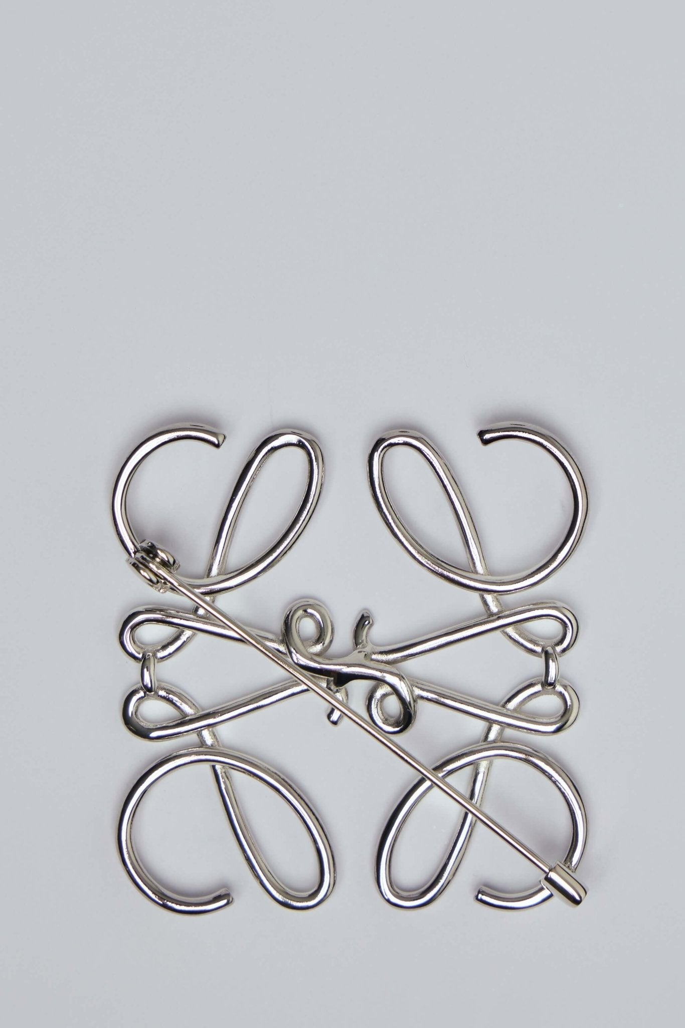 Anagram Brooch in Metal