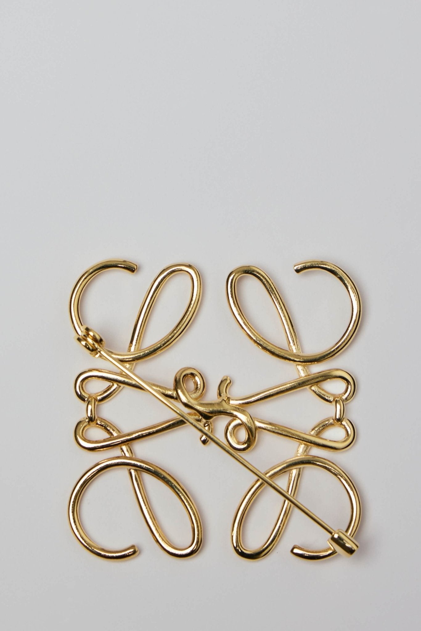 Anagram Brooch in Metal