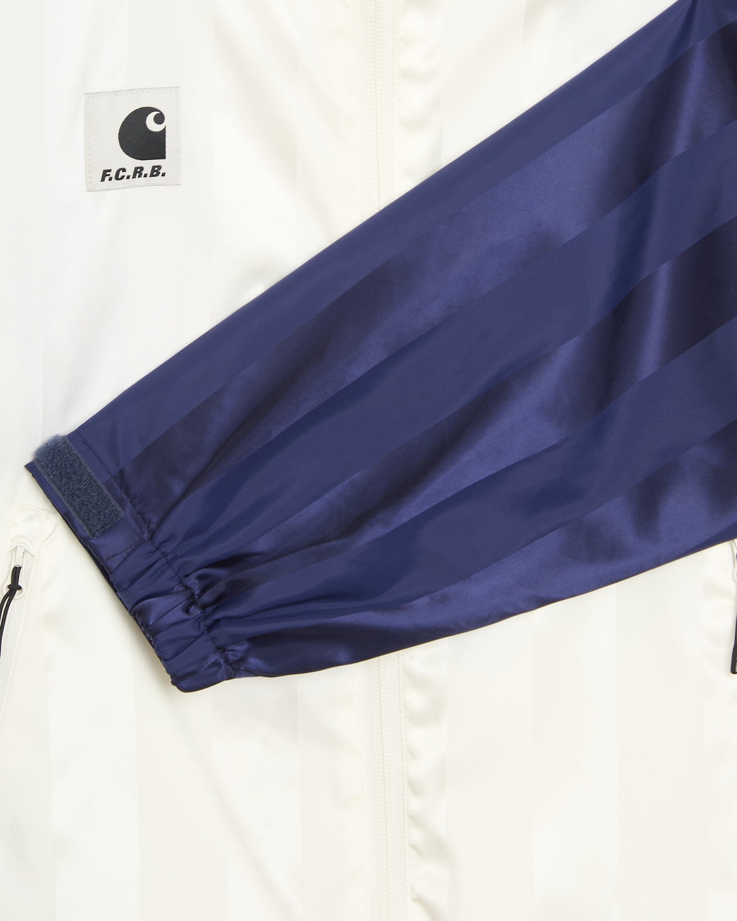 Sudadera con cremallera de rayas Carhartt WIP x F.C. Real Bristol Warm Up Unisex