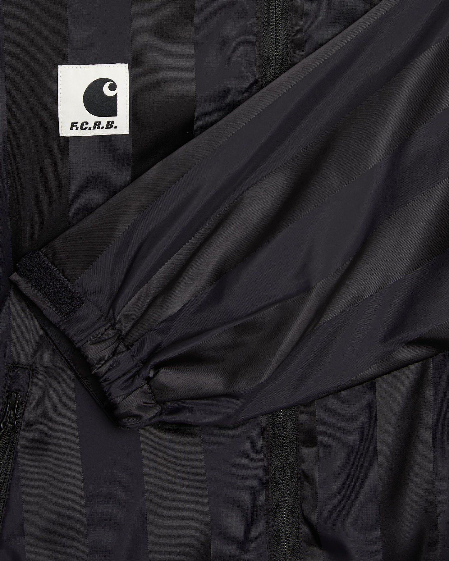 Sudadera con cremallera de rayas Carhartt WIP x F.C. Real Bristol Warm Up Unisex